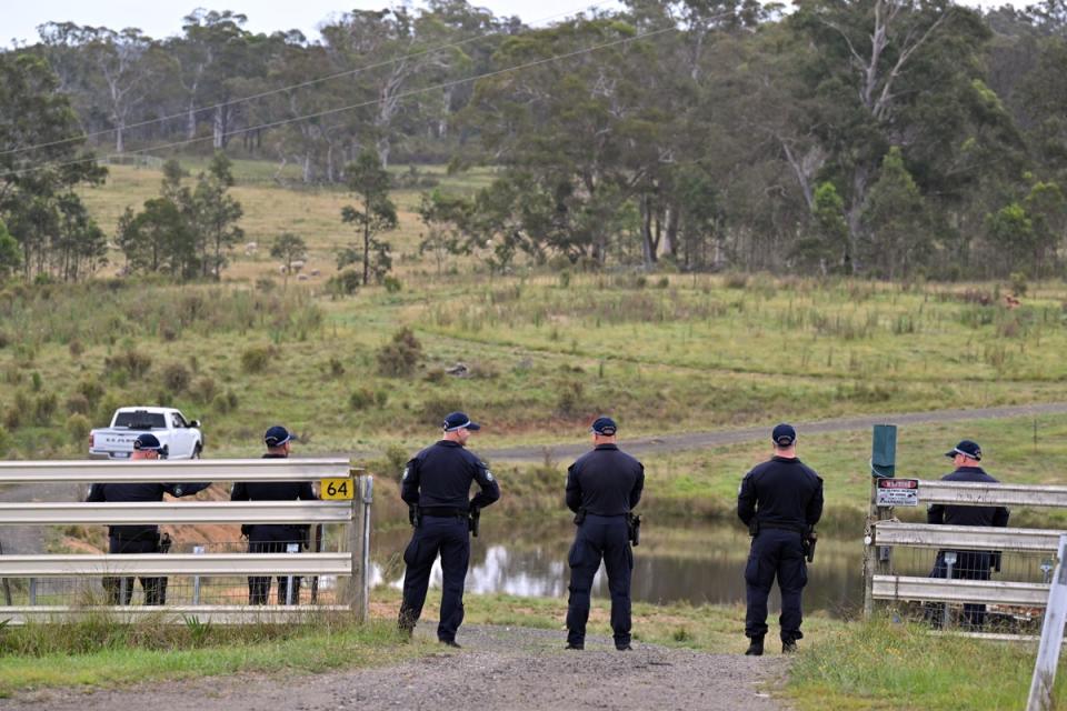 New South Wales police conduct a line search on a rural property on Hazelton Road in Bungonia (EPA)