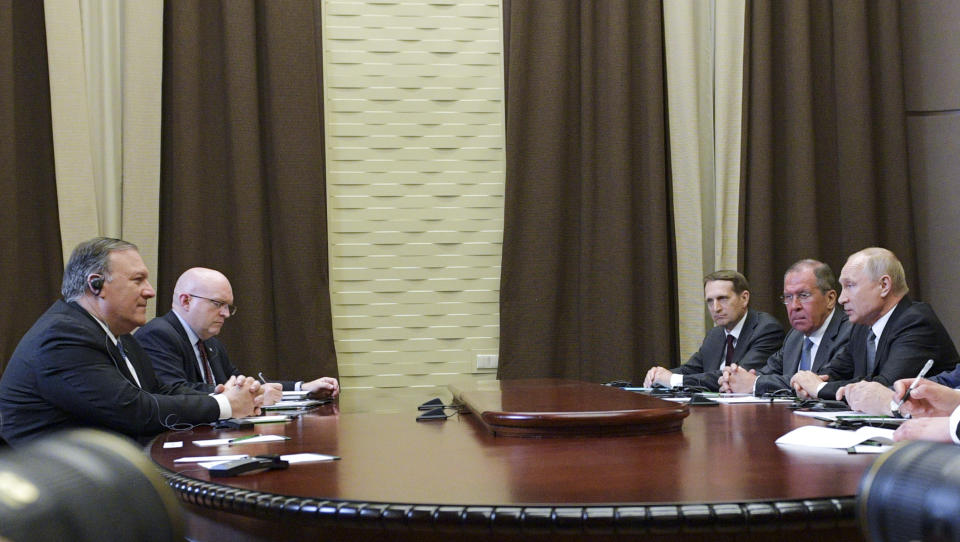 Russian President Vladimir Putin, right, speaks to U.S. Secretary of State Mike Pompeo, left, during their talks in the Black Sea resort city of Sochi, southern Russia, Tuesday, May 14, 2019. Pompeo arrived in Russia for talks that are expected to focus on an array of issues including arms control and Iran. Sergei Naryshkin, head of the Russian Foreign Intelligence Service is third on the right. (Alexei Druzhinin, Sputnik, Kremlin Pool Photo via AP)