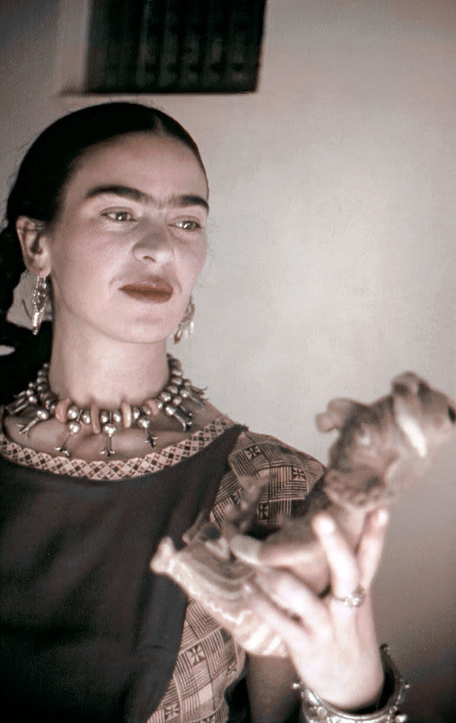 Kahlo posing for a portrait at home in 1940