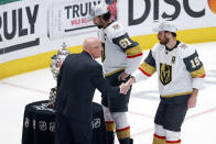 Vegas Golden Knights right wing Reilly Smith (19) shakes hands with deputy commissioner of the NHL Bill Daly after Game 6 of the NHL hockey Stanley Cup Western Conference finals against the Dallas Stars Monday, May 29, 2023, in Dallas. (AP Photo/Gareth Patterson)