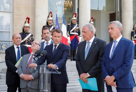 Macron, Vitorino, Castaner and Avramopoulos deliver a joint statement at the Elysee Palace in Paris