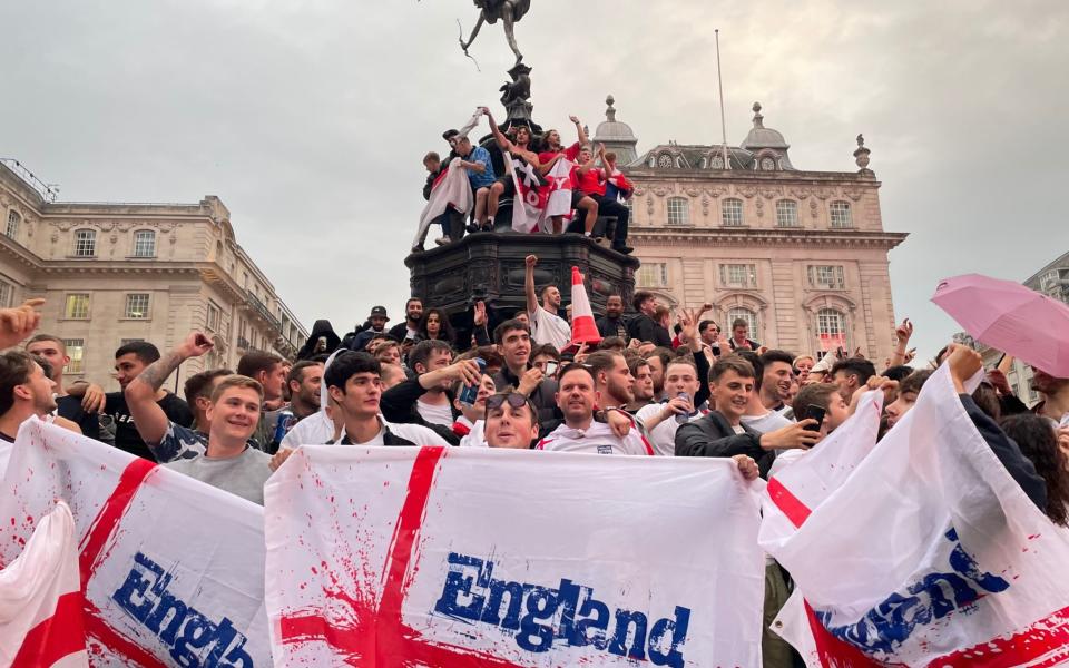 England fans celebrate victory over Germany in Piccadilly Circus on 29 June 2021 - Isobel Frodsham/PA