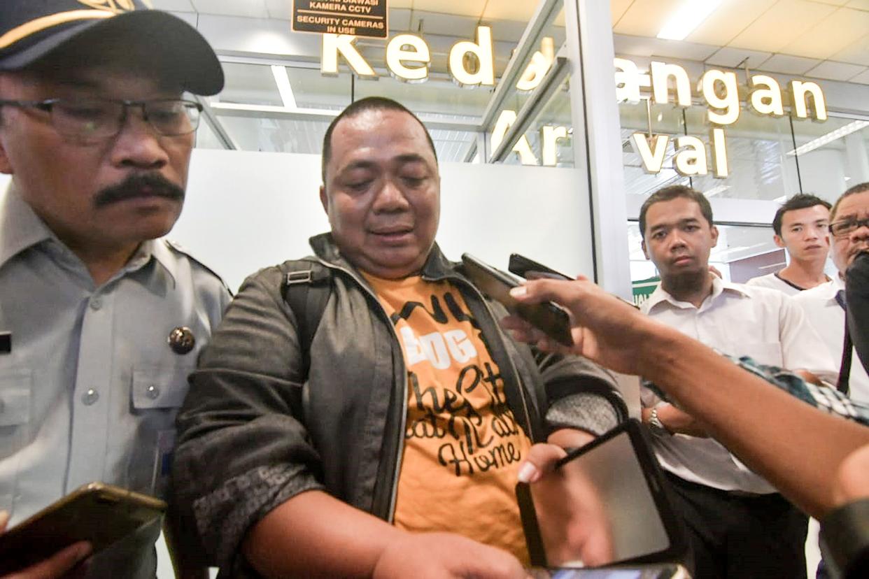 A man named Sony Setiawan (center) was late to the airport, missing Lion Air flight JT 610 which then crashed into the Java Sea. (Photo: Getty Images)