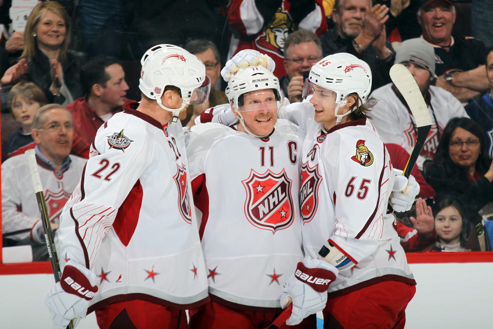 OTTAWA, ON - JANUARY 29: Daniel Alfredsson #11 of the Ottawa Senators and Team Alfredsson celebrates with Daniel Sedin #22 of the Vancouver Canucks and Erik Karlsson #65 of the Ottawa Senators after scoring a goal in the second period against Team Chara during the 2012 Tim Hortons NHL All-Star Game at Scotiabank Place on January 29, 2012 in Ottawa, Ontario, Canada. (Photo by Bruce Bennett/Getty Images)