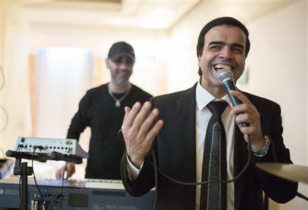 Israeli singer Zion Golan performs at a wedding celebration in the southern town of Netivot February 10, 2014. REUTERS/Amir Cohen