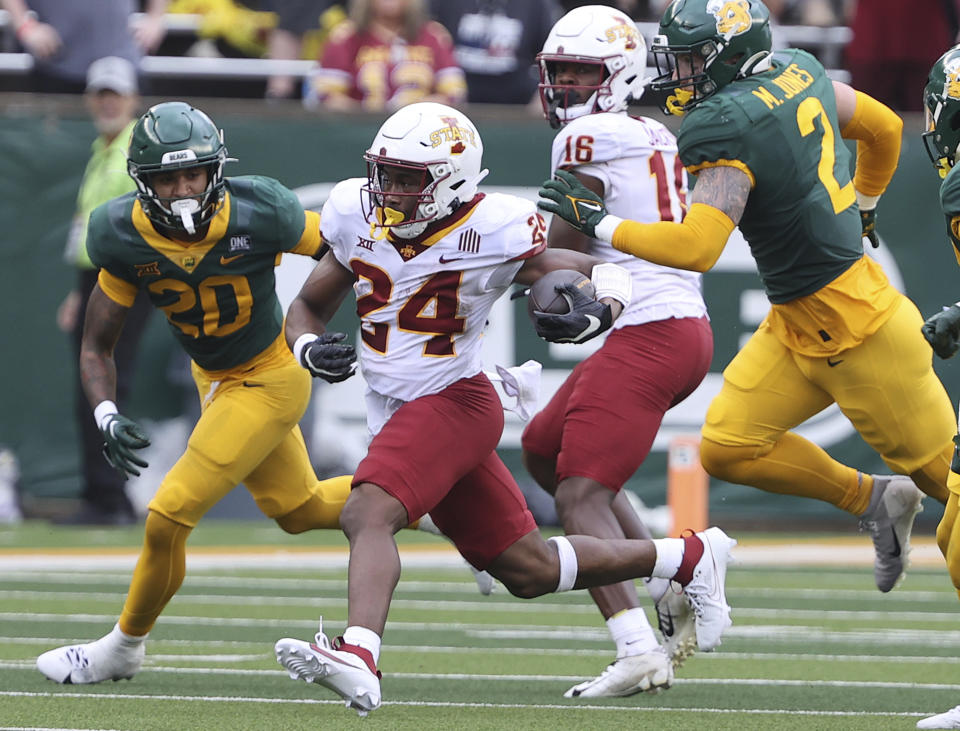 Iowa State running back Malik Verdon, left, runs past Baylor linebacker Matt Jones in the first half of an NCAA college football game, Saturday, Oct. 28, 2023, in Waco, Texas. (Jerry Larson/Waco Tribune-Herald via AP)