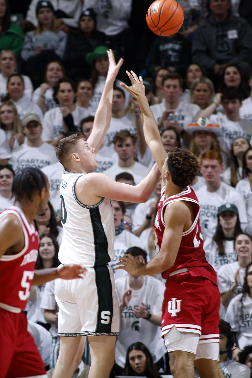 Michigan State's Jaxon Kohler, left, shoots against Indiana's Trayce Jackson-Davis during the first half of an NCAA college basketball game, Tuesday, Feb. 21, 2023, in East Lansing, Mich. (AP Photo/Al Goldis)