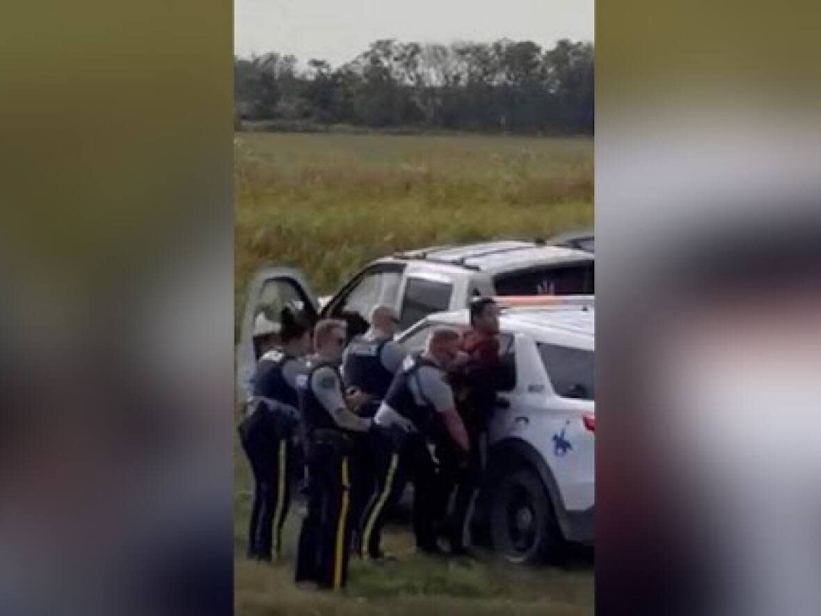 Myles Sanderson shown under arrest moments after RCMP forced his stolen truck off the highway. He died a short time later. (Dabber Gamble/Facebook - image credit)