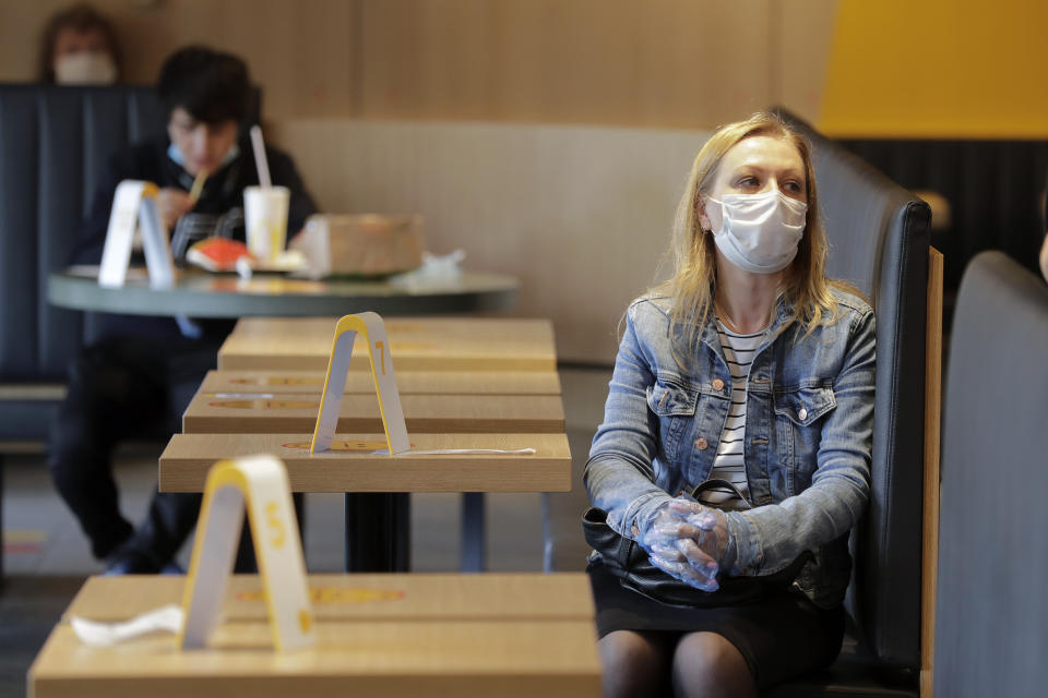 MOSCOW, RUSSIA - JUNE 23, 2020: A woman waites for her order in a McDonald's restaurant in central Moscow. The American fast food chain opens all of its 186 restaurants to visitors in Moscow from June 23 as part of another stage of the lifting of COVID-19 lockdown restrictions. Mikhail Metzel/TASS (Photo by Mikhail Metzel\TASS via Getty Images)