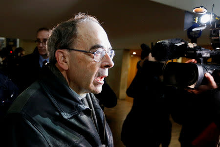 FILE PHOTO: Cardinal Philippe Barbarin, Archbishop of Lyon, arrives after a break in his trial, charged with failing to act on historical allegations of sexual abuse of boy scouts by a priest in his diocese, at the courthouse in Lyon, France, January 7, 2019. REUTERS/Emmanuel Foudrot/File Photo