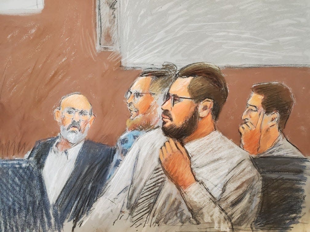 Four men charged with plotting to kidnap Gov. Gretchen Whitmer listen as one of their codefendants testifies against them on March 24, 2022 in U.S. District Court. From left to right are: Barry Croft, Brandon Caserta, Adam Fox and Daniel Harris.