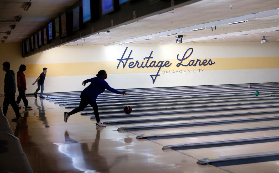 People bowl Jan. 12 at Heritage Lanes in Oklahoma City. The bowling alley, which opened in 1981, is being converted into an Andy B's center.
