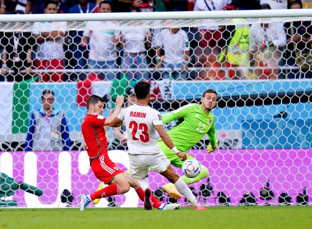 Ramin Rezaeian, centre scores Iran’s second goal against Wales