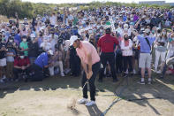 Scottie Scheffler hits his second shot on the 13th hole during the final round of the Dell Technologies Match Play Championship golf tournament Sunday, March 28, 2021, in Austin, Texas. (AP Photo/David J. Phillip)