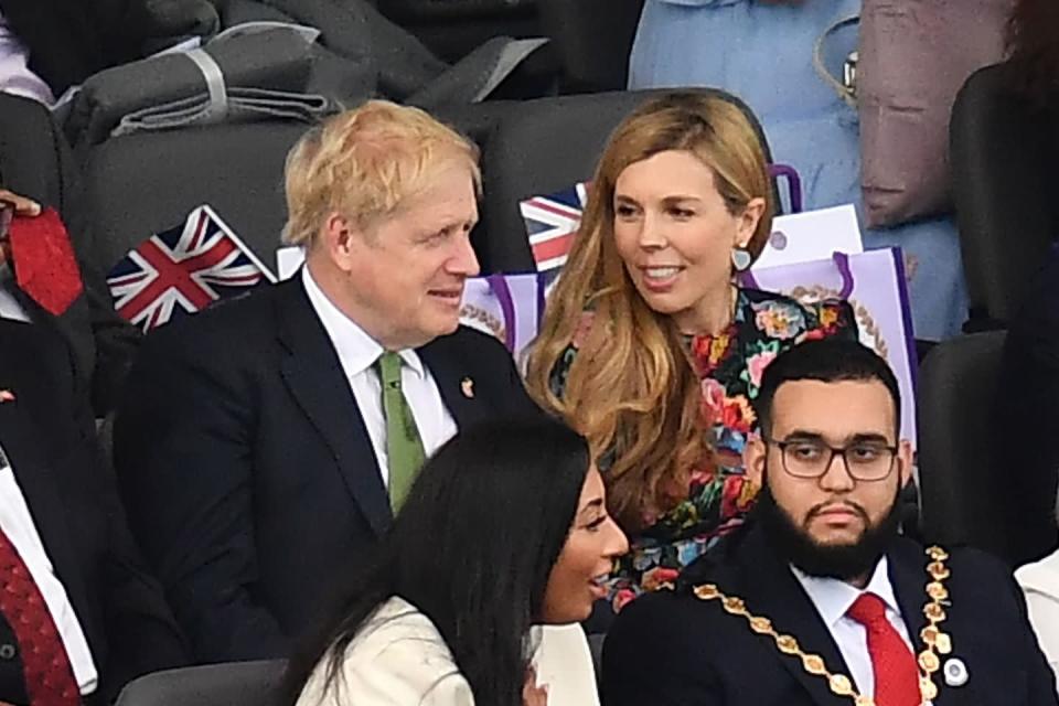 <p>British Prime Minister Boris Johnson and his wife Carrie Johnson take their seats </p>