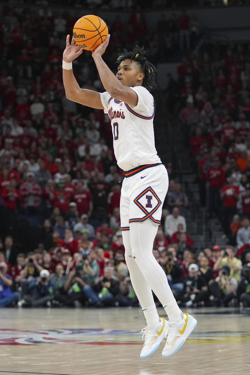 Illinois guard Terrence Shannon Jr. (0) shoots during the second half of an NCAA college basketball game against Wisconsin in the championship of the Big Ten Conference tournament, Sunday, March 17, 2024, in Minneapolis. (AP Photo/Abbie Parr)