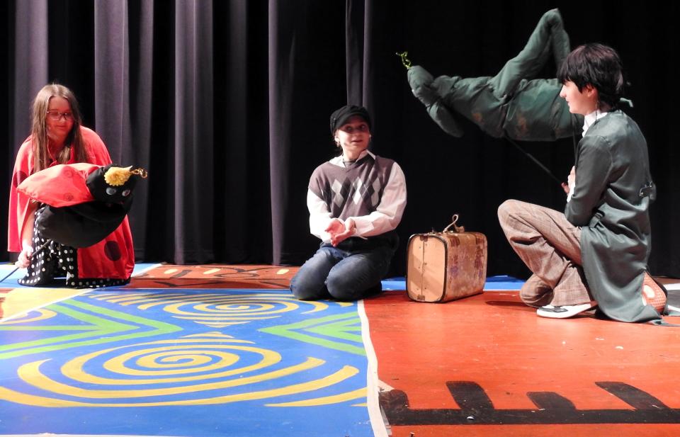 Tayvah Duran as Ladybug, Alahna Thompson as James and Finn Webb as Grasshopper rehearse a scene from "James and the Giant Peach: The Musical" playing Friday and Saturday at Coshocton High School. There are 38 students involved with a majority from junior high.