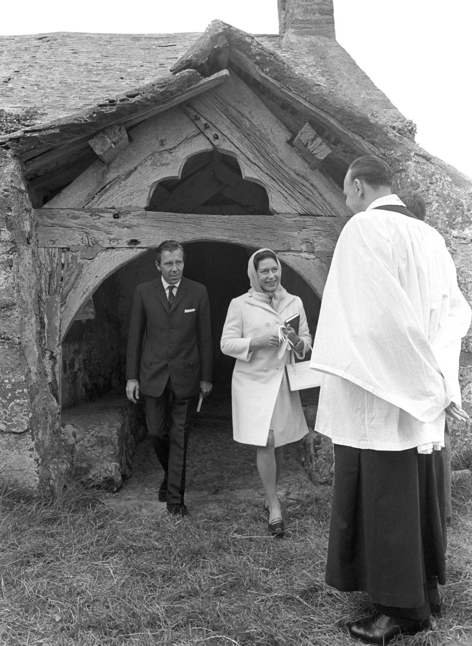 Princess Margaret and Lord Snowdon saying goodbye to the Rev. Robert E. Williams, the vicar, as they leave the 13th century Llanfaglan Parish Church, near Caernarfon, Wales.