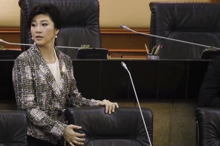 Ousted former Prime Minister Yingluck Shinawatra prepares to deliver her statement at the National Legislative Assembly meeting in Bangkok January 22, 2015. REUTERS/Chaiwat Subprasom