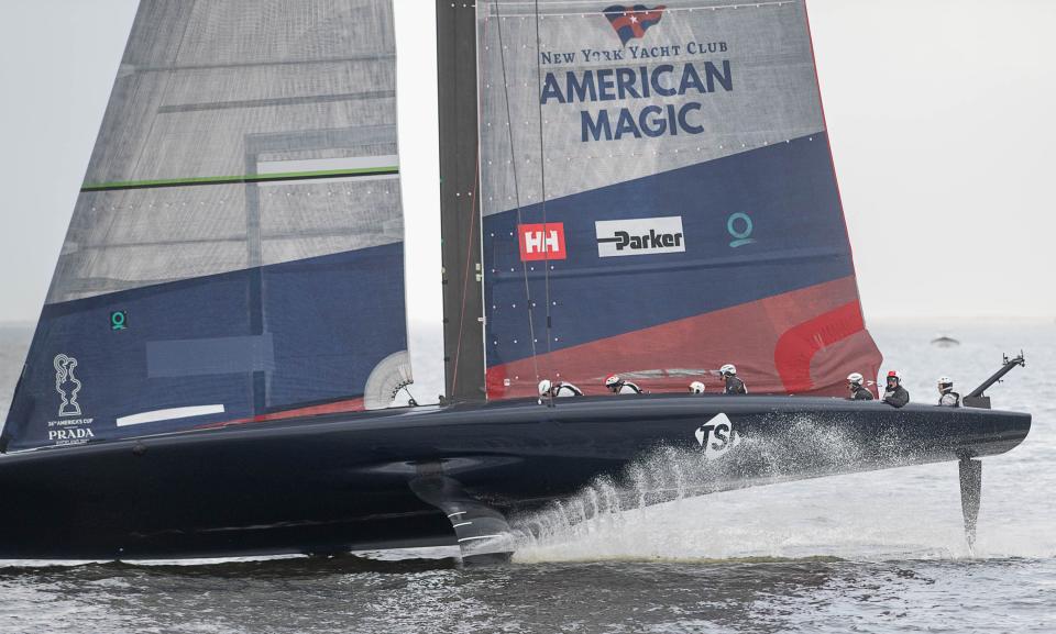The American Magic sailboat makes several passes past the Palafox Pier in downtown Pensacola as it prepares for the America's Cup on Friday, Dec. 2, 2022.