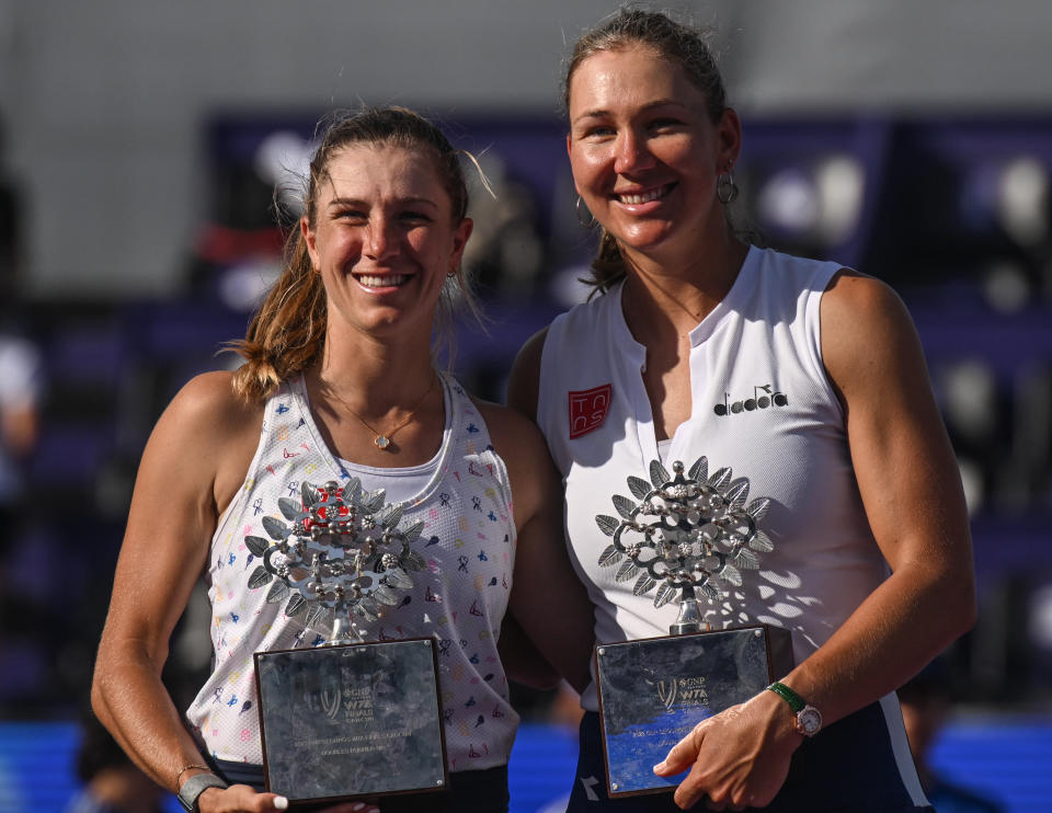 Nicole Melichar-Martinez and Ellen Perez with their trophies.