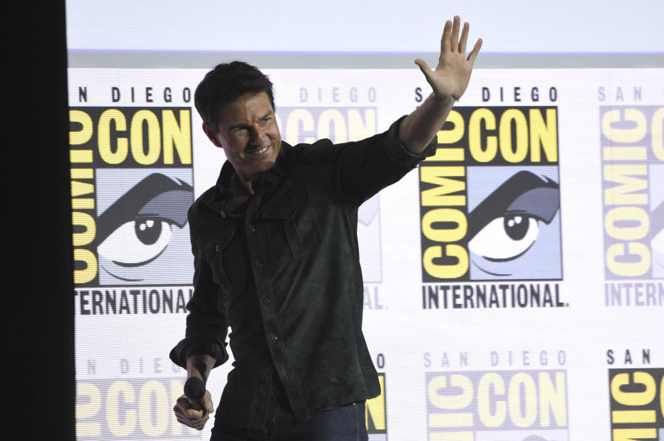 Tom Cruise waves to the audience after presenting a clip from "Top Gun: Maverick" on day one of Comic-Con International on Thursday, July 18, 2019, in San Diego. (Photo by Chris Pizzello/Invision/AP)