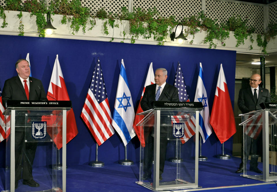 Israeli Prime Minister Benjamin Netanyahu, center, and Bahrain's Foreign Minister Abdullatif bin Rashid Alzayani, right, listen as U.S. Secretary of State Mike Pompeo speaks during a joint press conference after their trilateral meeting in Jerusalem on Wednesday, Nov. 18, 2020. (Menahem Kahana/Pool via AP)