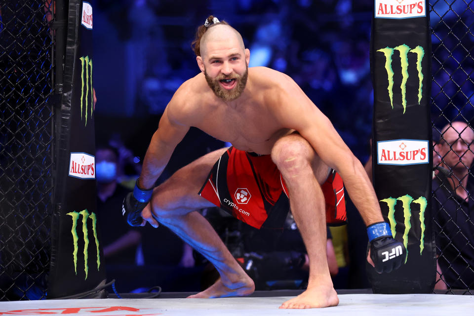 SINGAPORE, SINGAPORE - JUNE 12: Jiri Prochazka of the Czech Republic enters the octagon for his light heavyweight title bout against Glover Teixeira of Brazil during UFC 275 at Singapore Indoor Stadium on June 12, 2022 in Singapore. (Photo by Yong Teck Lim/Getty Images)