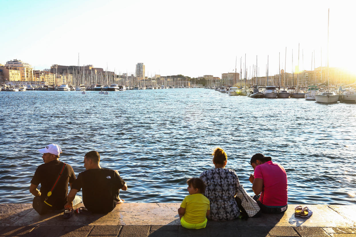 MARSEILLE, FRANCE - AUGUST 05: People setting by Le Vieux Port in Marseille city center on August 05, 2023, as a heatwave continues across northern Europe, with wildfires breaking out in northern Scandanavia and Greece. (Photo by Ibrahim Ezzat/Anadolu Agency via Getty Images)