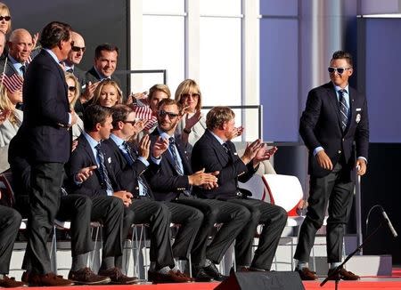 Sep 29, 2016; Chaska, MN, USA; Rickie Fowler of the United States smiles at Phil Mickelson of the United States during the Opening Ceremony for the 41st Ryder Cup at Hazeltine National Golf Club. Mandatory Credit: Rob Schumacher-USA TODAY Sports