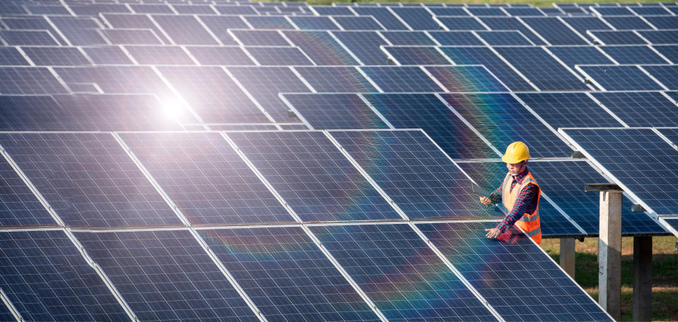 Solar cell power engineer technician checks the maintenance of the solar panels.