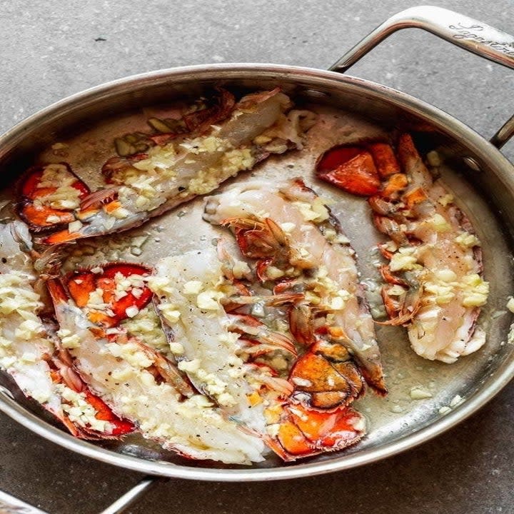 Lobster tails in a pan.