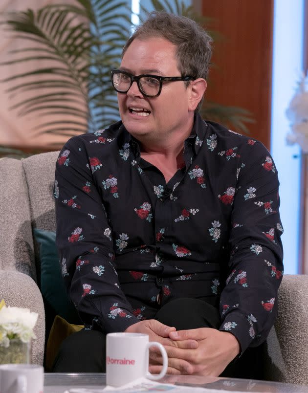 Alan Carr dons coconut shell bra as he pines for a trip abroad in