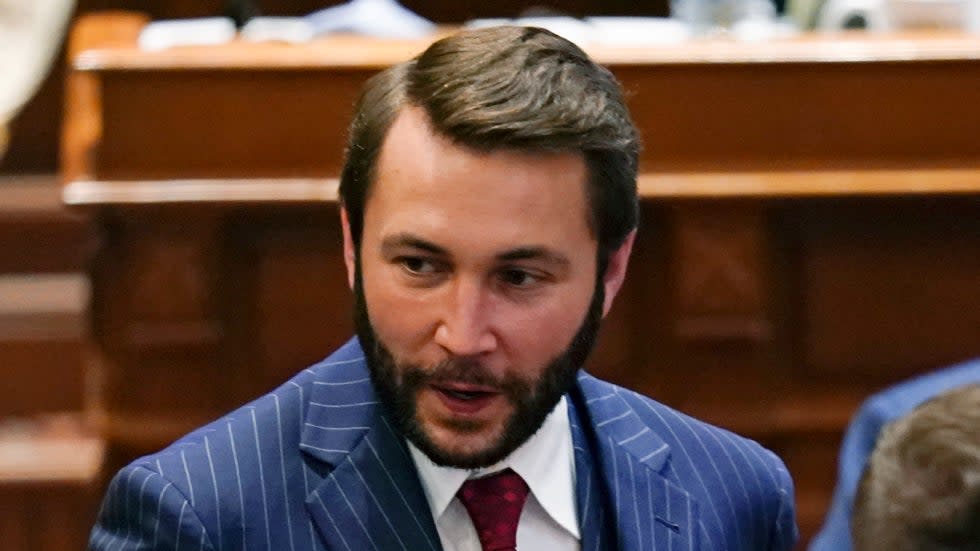 State Rep. Bobby Kaufmann (R) walks through the Iowa Senate chamber in 2021