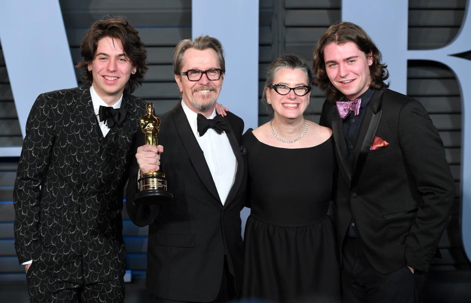 Gary Oldman with his current wife Gisele Schmidt and sons Gulliver Oldman and Charlie Oldman at the Vanity Fair Oscar Party in 2018.