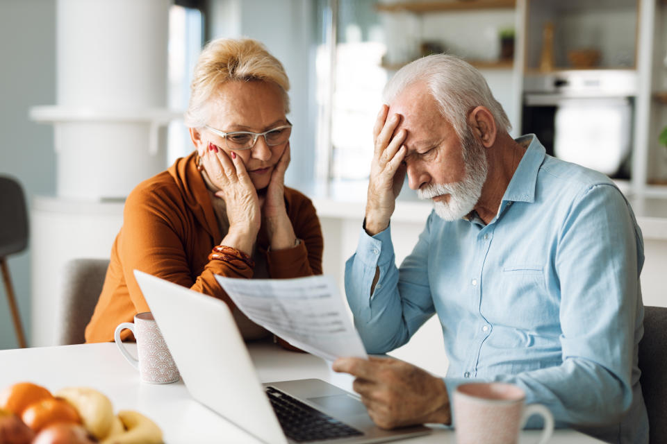 Worried couple feeling stressed while they have to pay off mortgage. (Getty Images)