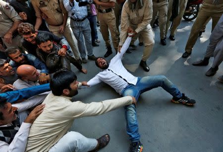 A supporter of Awami Ittihad Party (AIP), a pro-India party, is detained by Indian police during a protest demanding to hold a plebiscite, in Srinagar, September 26, 2016. REUTERS/Danish Ismail