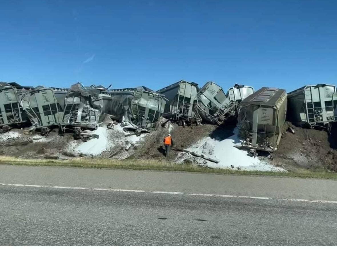 About 43 CP Rail cars carrying potash were derailed northeast of Fort Macleod on Sunday, said RCMP. (Submitted by Rhonda Sauerberg - image credit)