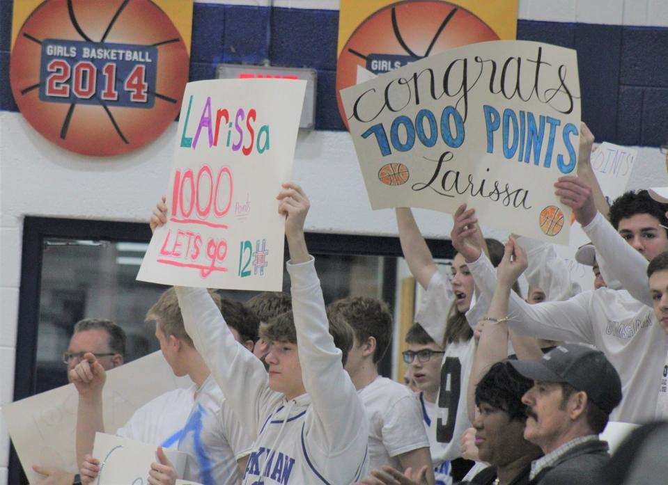 The Mackinaw City student section celebrates senior Larissa Huffman reaching 1,000 career points during the first quarter on Wednesday.