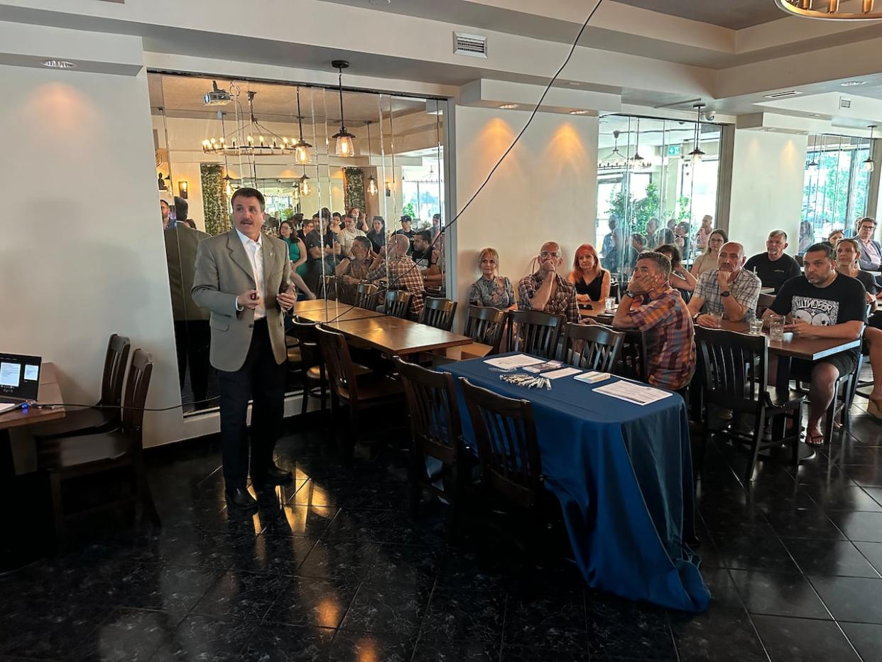 Barry Horrobin, the director of planning and physical resources for the Windsor Police Service, spoke at a community meeting for Erie Street business owners on Tuesday, May 21, 2024.  (Dale Molnar/CBC - image credit)