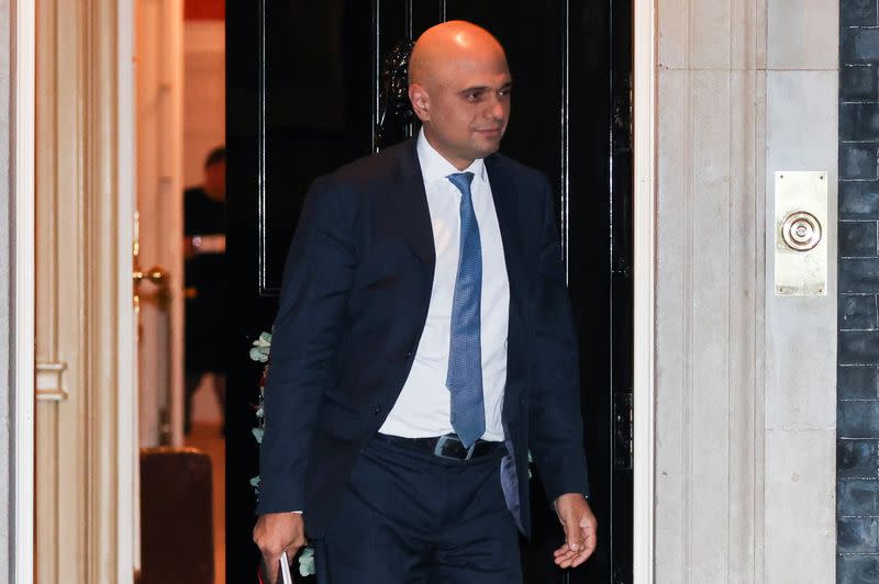 Britain's Health Secretary Sajid Javid walks at Downing Street in London