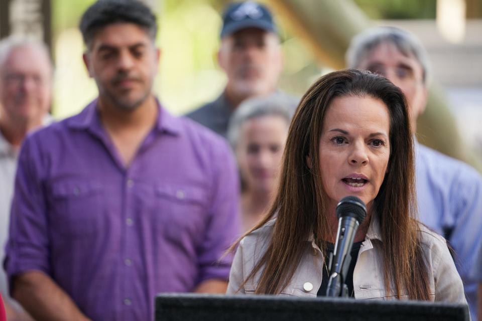 Marlene Galán-Woods, a former journalist, speaks to media during a news conference at the Arizona State University Downtown Phoenix campus on Oct. 19, 2022.