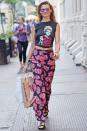 <p>Printed trousers can really pack a punch, as shown by Behati Prinsloo – and they are great for that in-between weather. Pair them with a simple T-shirt and sandals when it's warm, then slip on Converse trainers and a denim jacket when the evening breeze hits.</p>