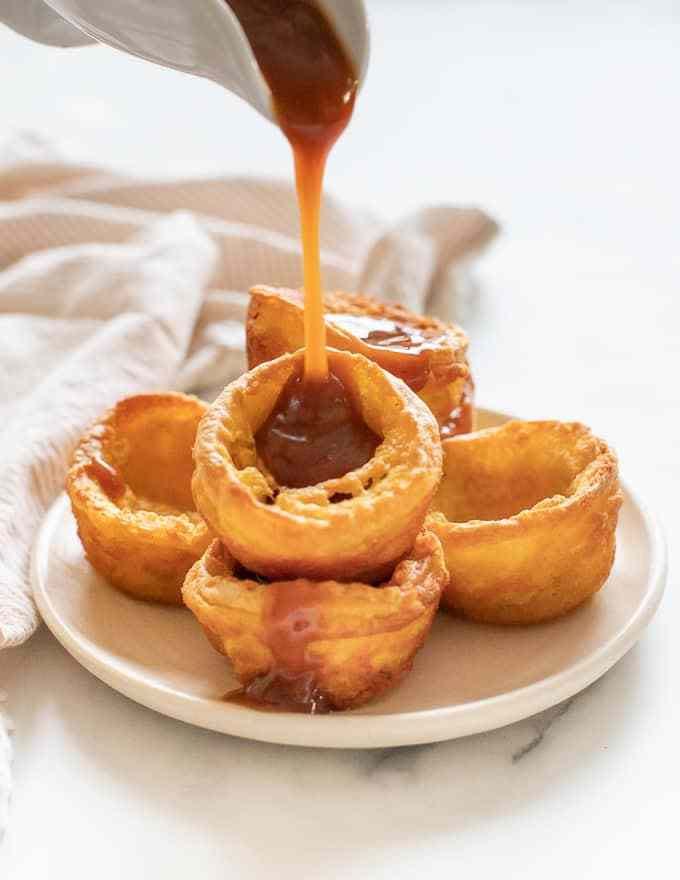 <p>No Christmas dinner is complete without Yorkshire puds, and just because you're vegan doesn't mean you should be missing out!</p><p>Get the <a href="https://avirtualvegan.com/vegan-yorkshire-puddings#wprm-recipe-container-17247" rel="nofollow noopener" target="_blank" data-ylk="slk:Vegan Yorkshire Puddings;elm:context_link;itc:0;sec:content-canvas" class="link ">Vegan Yorkshire Puddings</a> recipe. </p><p>Recipe from <a href="https://avirtualvegan.com/" rel="nofollow noopener" target="_blank" data-ylk="slk:A Virtual Vegan;elm:context_link;itc:0;sec:content-canvas" class="link ">A Virtual Vegan</a>.</p>