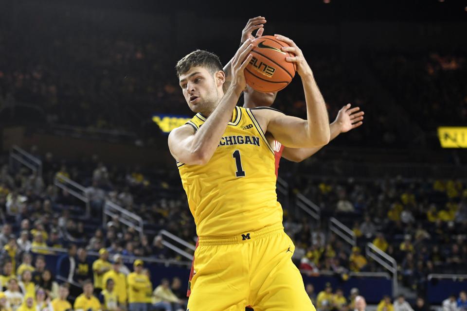 Michigan center Hunter Dickinson rebounds against Maryland in the first half on Sunday, Jan. 1, 2023, at Crisler Center.
