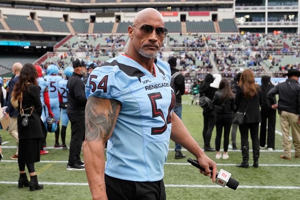 XFL co-owner Dwayne Johnson walks on the sidelines during the first half of an XFL game between the Vegas Vipers and the Arlington Renegades at Choctaw Stadium in Arlington, Texas on Feb. 18, 2023.