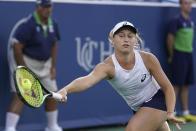 Daria Gavrilova, of Australia, returns Serena Williams in the first round at the Western & Southern tennis Open, Monday, Aug. 13, 2018, in Mason, Ohio. (AP Photo/John Minchillo)