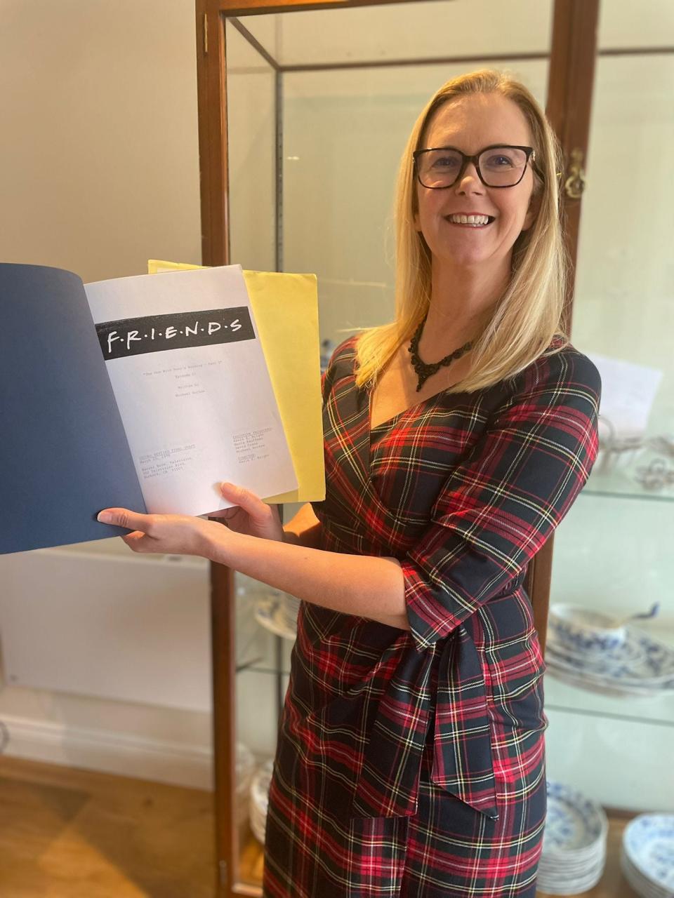 Amanda Butler, head of Hanson Ross, with the "Friends" scripts.