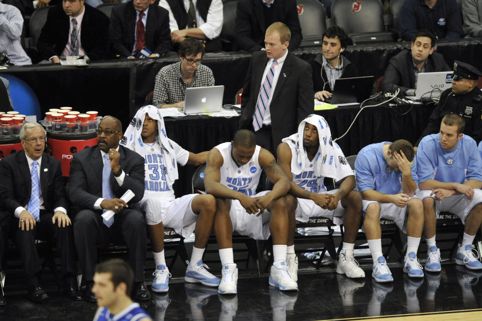 Mar 27, 2011; Newark, NJ, USA; North Carolina Tar Heels players including forward <a class="link " href="https://sports.yahoo.com/nba/players/5020/" data-i13n="sec:content-canvas;subsec:anchor_text;elm:context_link" data-ylk="slk:John Henson;sec:content-canvas;subsec:anchor_text;elm:context_link;itc:0">John Henson</a> (31) and forward Justin Knox (25) and guard Justin Watts (24) on the bench late in the second half against the Kentucky Wildcats during the finals of the east regional of the 2011 NCAA men’s basketball tournament at the Prudential Center. Kentucky defeated North Carolina 76-69. Mandatory Credit: Howard Smith-USA TODAY Sports