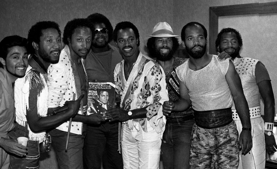 Singers and musicians (unnamed band member), Paul Harrell, Felton Pilate, (unnamed band member), Michael Cooper, Louis McCall, Cedric Martin and Karl Fuller of ConFunkShun poses for photos backstage at the Holiday Star Theatre in Merrillville, Indiana in 1984. - Credit: Raymond Boyd/Getty Images